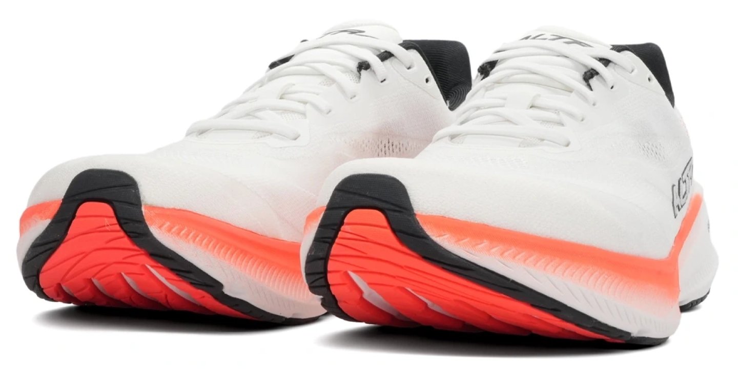 Altra Experience Flow 3 running shoes in white and coral, rear three-quarter view showing midsole cushioning and outsole detail