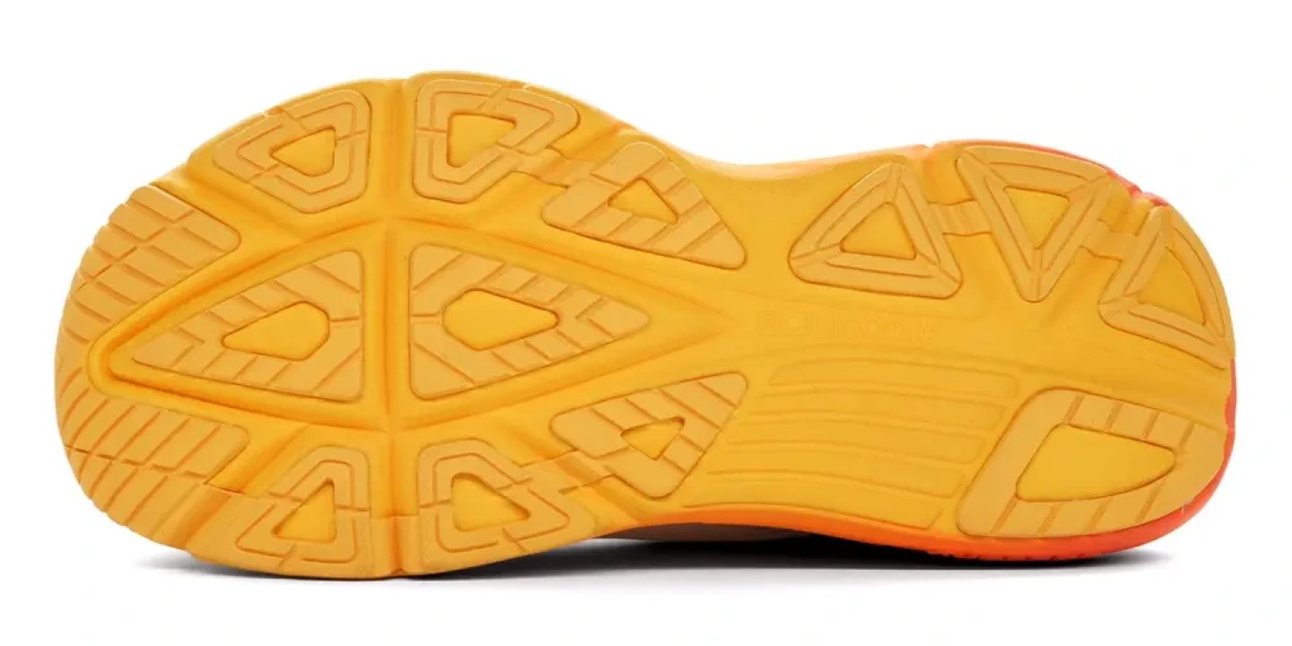 Bottom view of the Saucony Guide 3 running shoe outsole in yellow and orange with triangular lug traction pattern