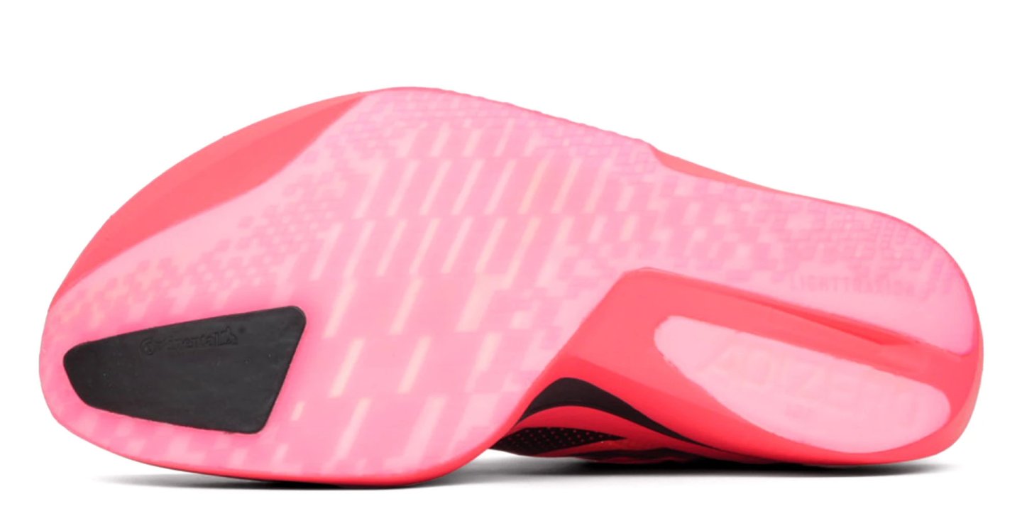 Bottom view of Adidas Adizero Adios Pro 5 running shoe showing pink outsole with Continental rubber heel patch and traction grooves