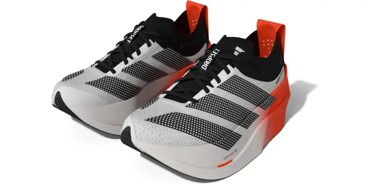 Adidas Adizero Dropset Elite shoes in white, black and solar red, shown as a pair at a three-quarter angle