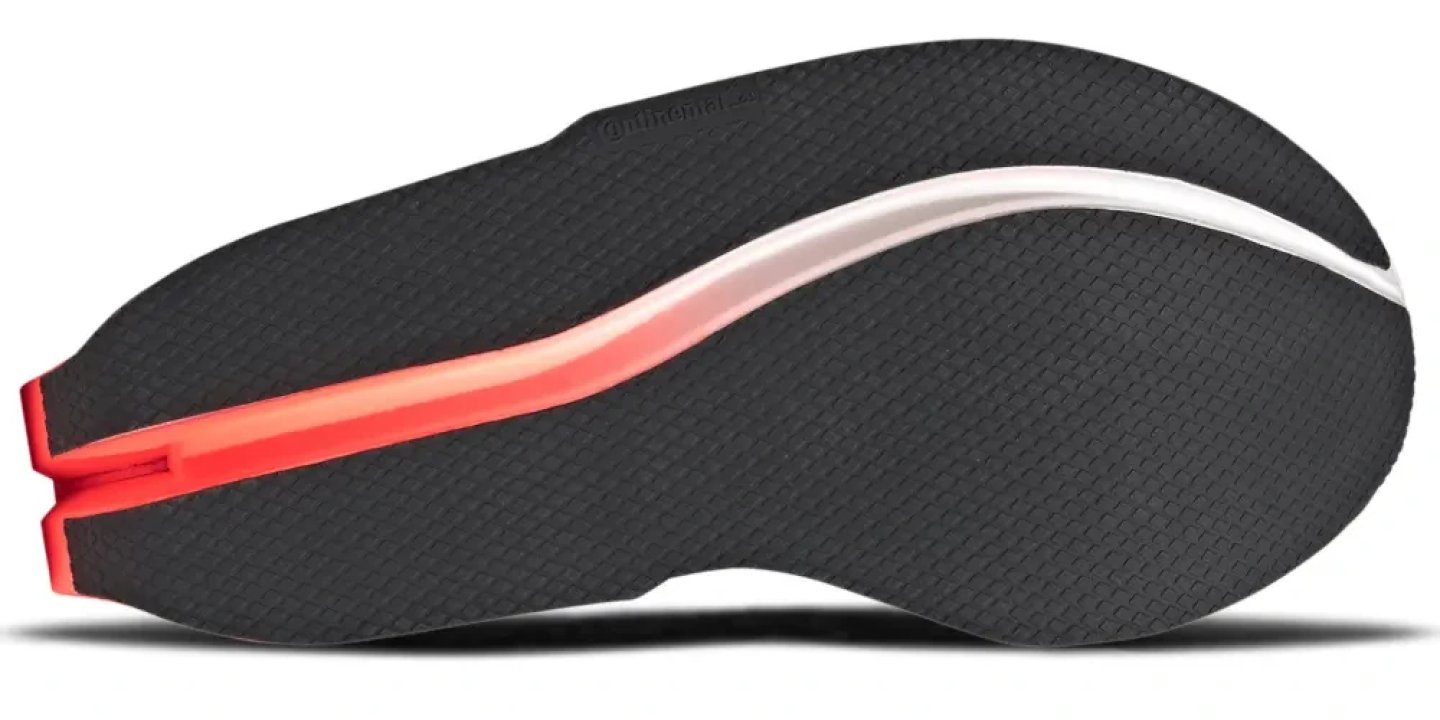 Bottom view of the Adidas Adizero Dropset Elite showing black Continental rubber outsole with red and white midsole detail