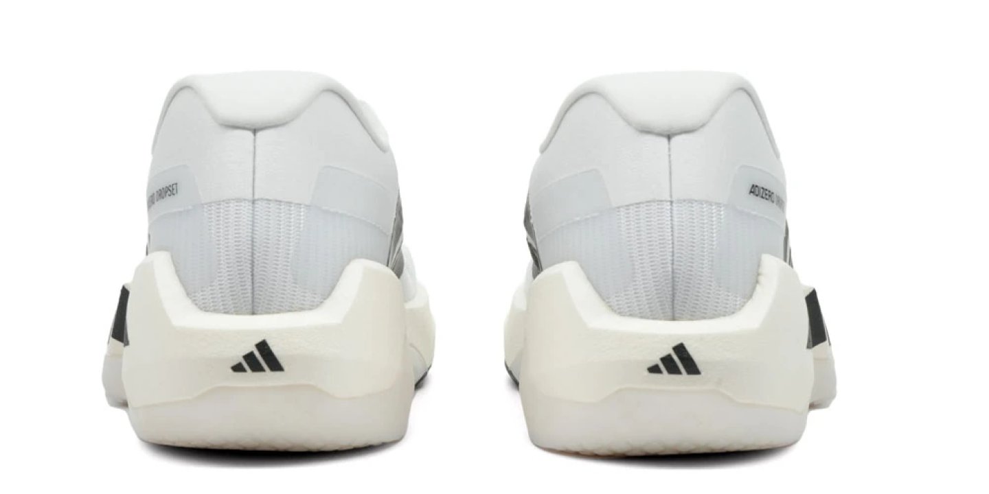 Rear view of two Adidas Adizero Dropset Pro Trainer training shoes in white with black Three Stripes logo on the heel