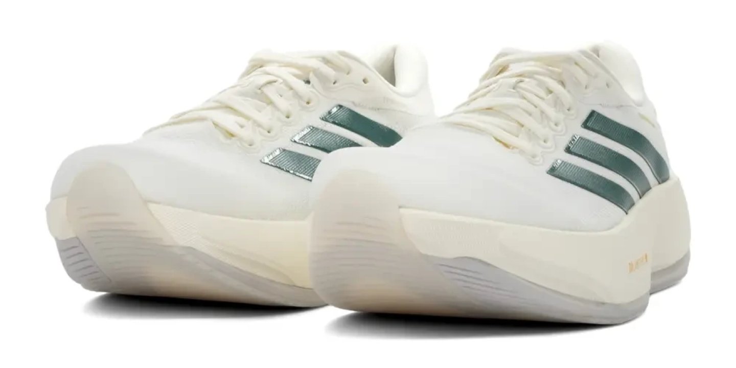 Front view of Adidas Supernova Prima 3 running shoes in off-white with metallic teal Three Stripes and thick cushioned midsole