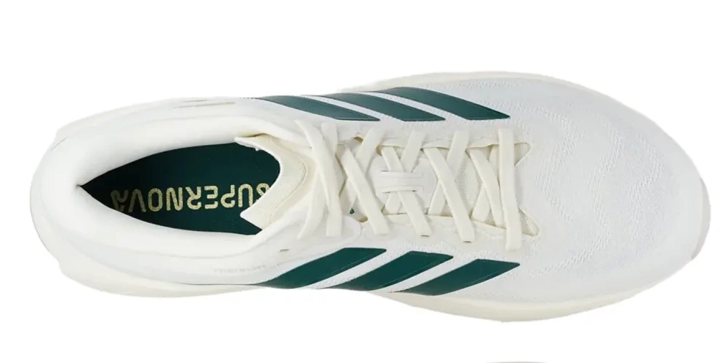 Top-down view of the Adidas Supernova Prima 3 running shoe in white with green three-stripe branding and matching insole logo.