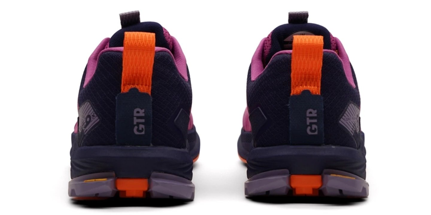Rear view of the Altra Lone Peak 9+ trail running shoes showing the GTR heel counter, orange pull tab and purple outsole