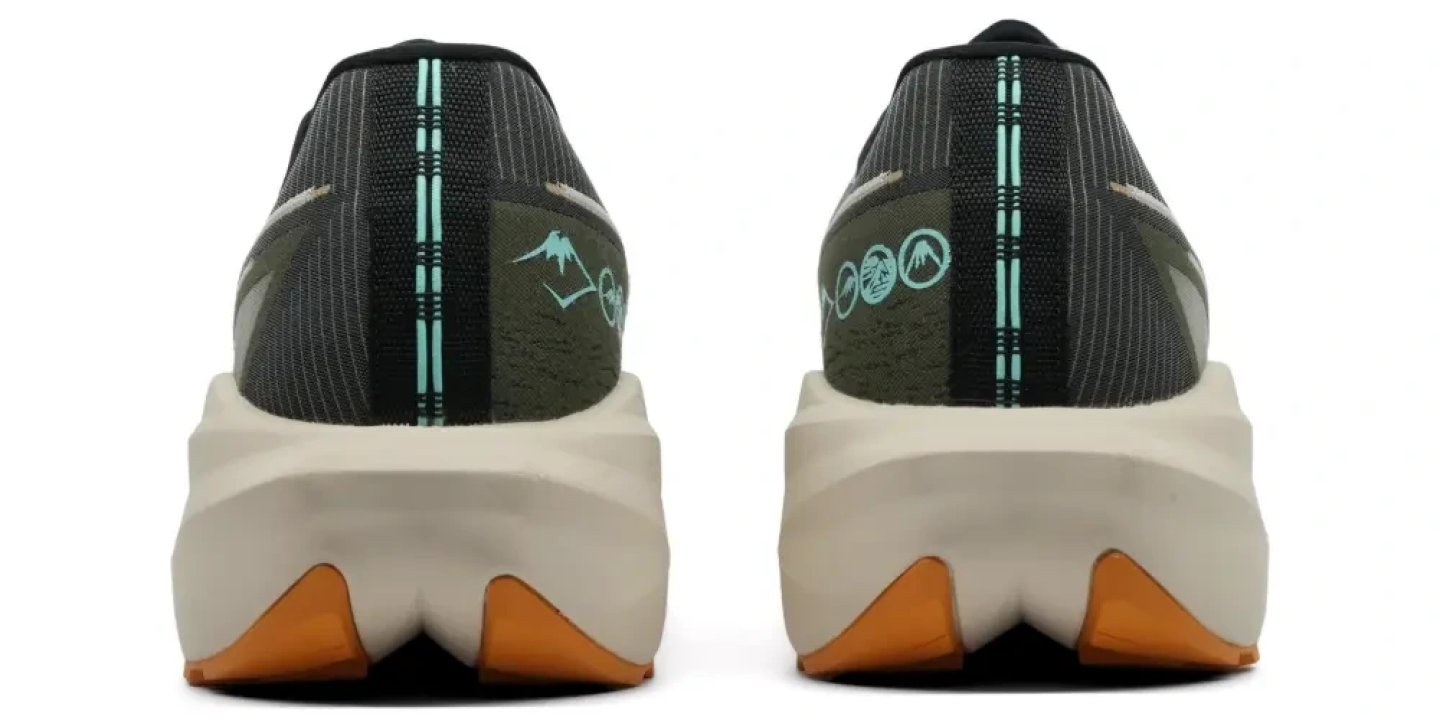 Rear view of two Asics Blazeblast running shoes showing teal heel graphics, cream midsole, and amber outsole lugs