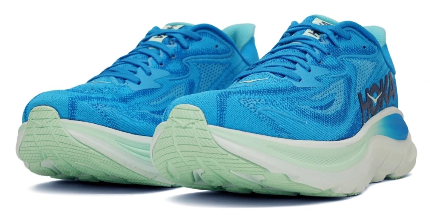 Pair of HOKA running shoes in vivid blue with mint green chunky midsole and white outsole, shown from front three-quarter angle.