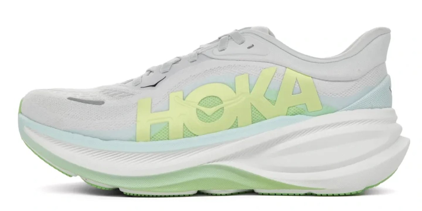 Hoka Clifton Pro running shoe in white with lime yellow branding and mint green midsole, lateral view