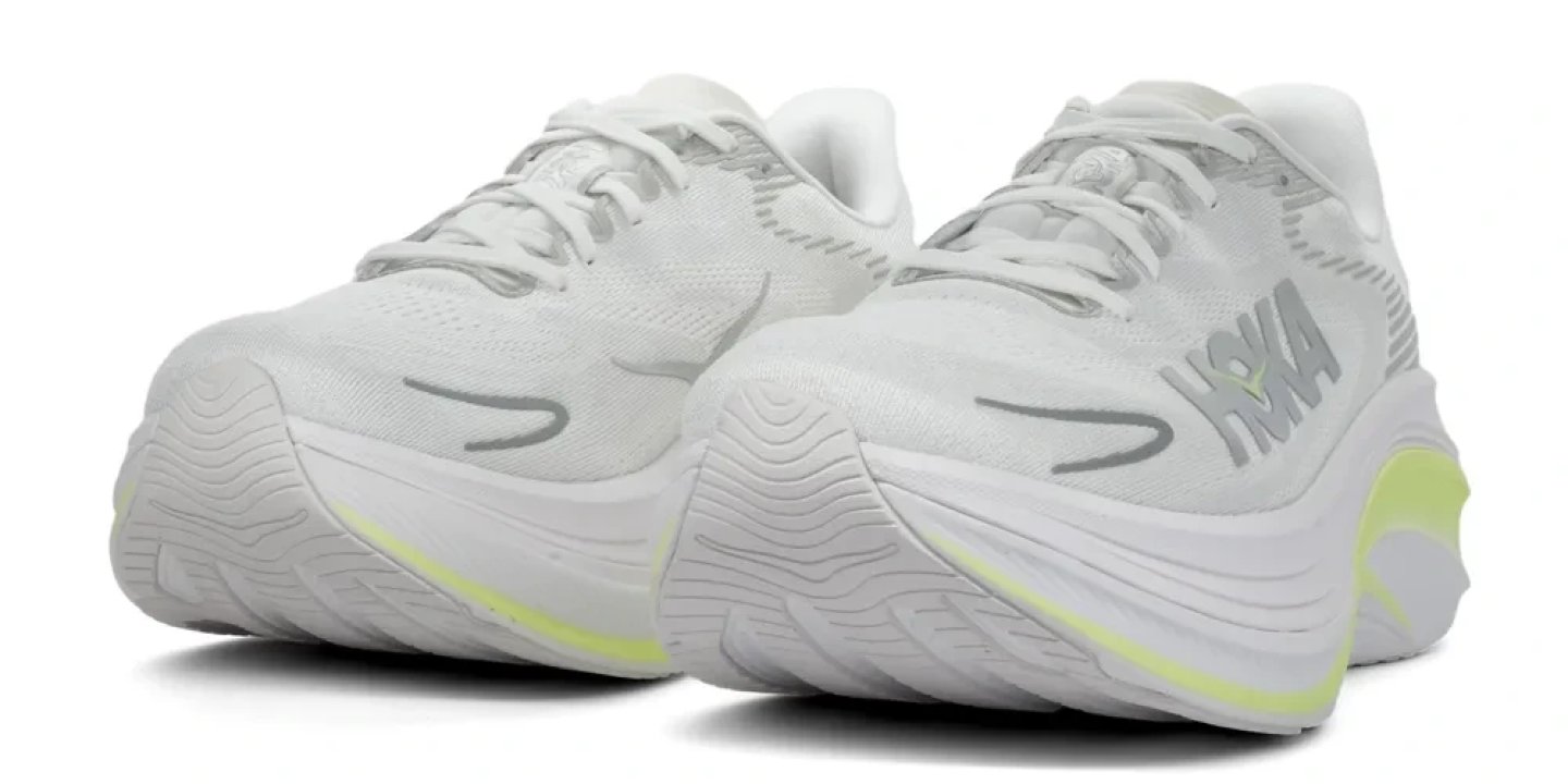 Rear three-quarter view of the Hoka Skyward X 2 running shoe in white with neon yellow midsole accents