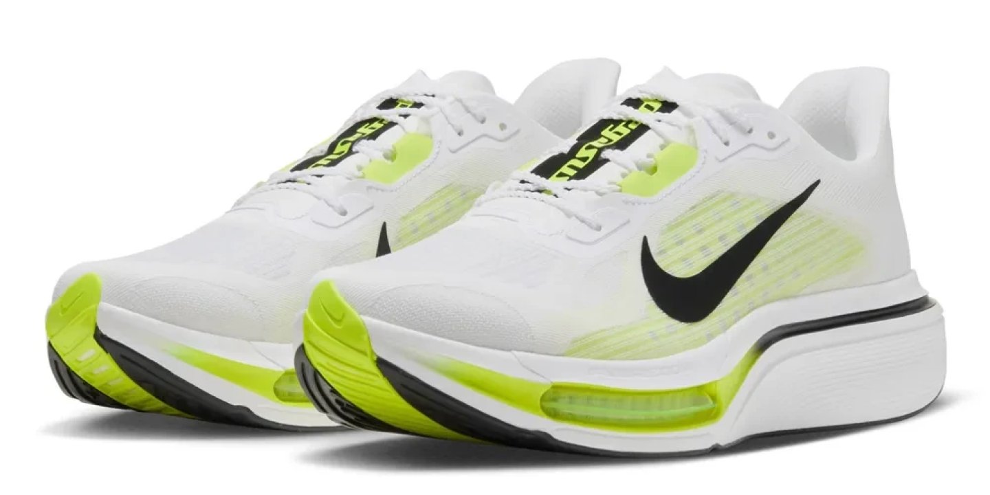 Nike Pegasus Plus 2 running shoes in white and volt green with black Swoosh, shown as a pair on a white background.