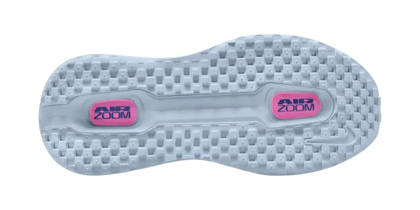 Bottom view of Nike Vomero Premium shoe outsole showing two pink Air Zoom units and grey waffle tread pattern