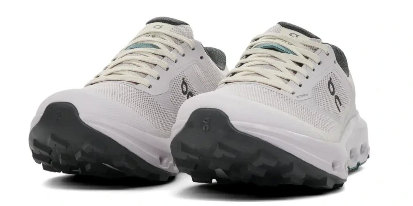 Rear view of On Cloudvista 3 WP waterproof trail running shoes in white and dark grey with chunky rubber outsole