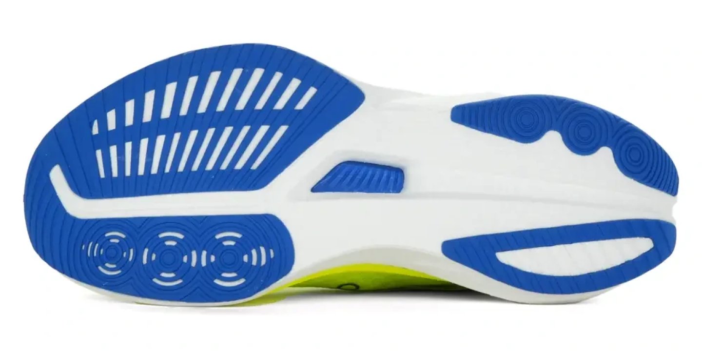 Bottom view of the Saucony Endorphin Speed 5 running shoe outsole with blue rubber traction pods and white midsole