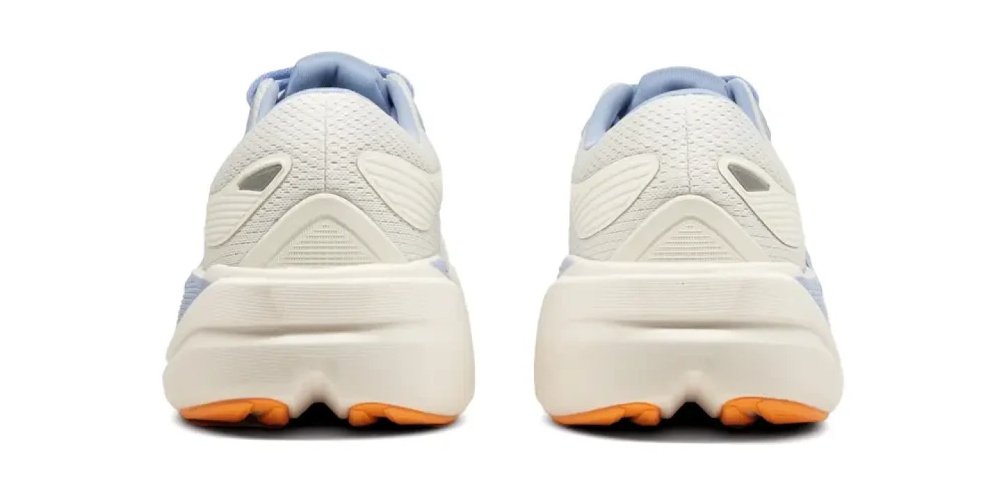Rear view of Brooks Ghost Max 3 running shoes in white and light blue with an orange outsole