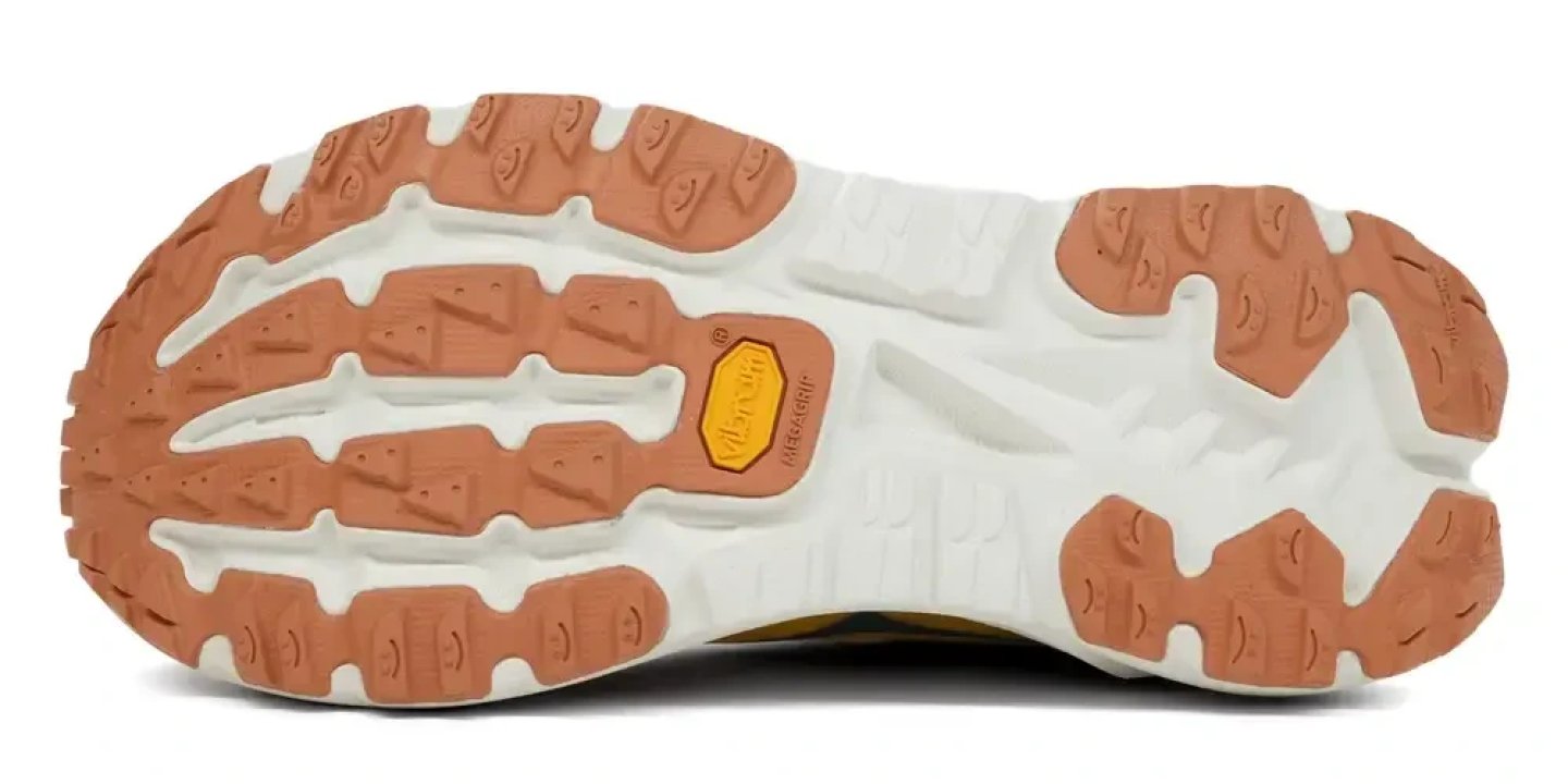Bottom view of Hoka Mafate X trail running shoe outsole showing Vibram Megagrip rubber lugs in terracotta and white
