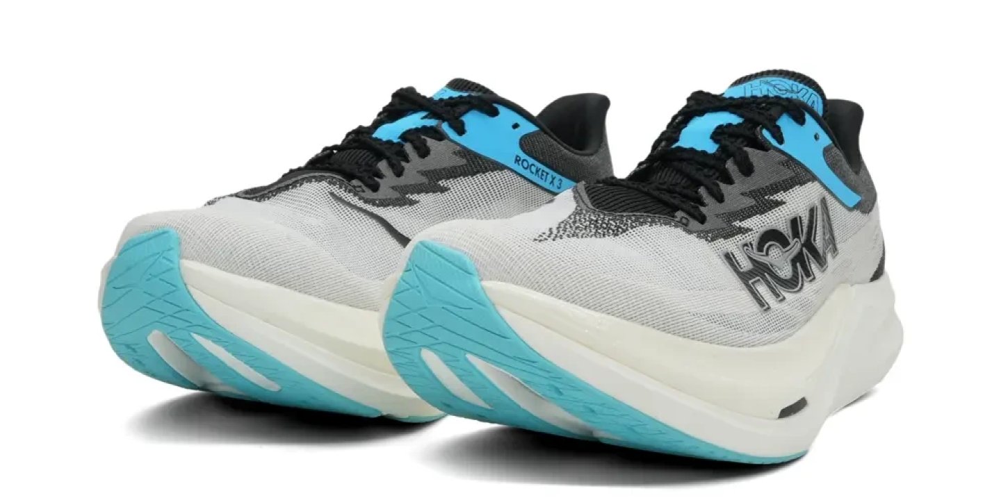 Hoka Rocket X 3 running shoes in white, black, and cyan blue, rear three-quarter view showing thick midsole