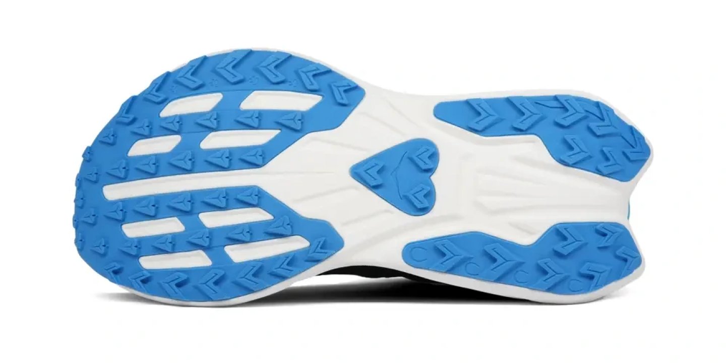 Bottom view of Hoka Rocket X Trail running shoe outsole showing blue multi-directional lugs and white midsole construction