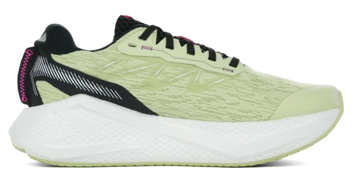 Lime green and black running shoe with chunky white foam midsole and pink accent stitching, lateral view.