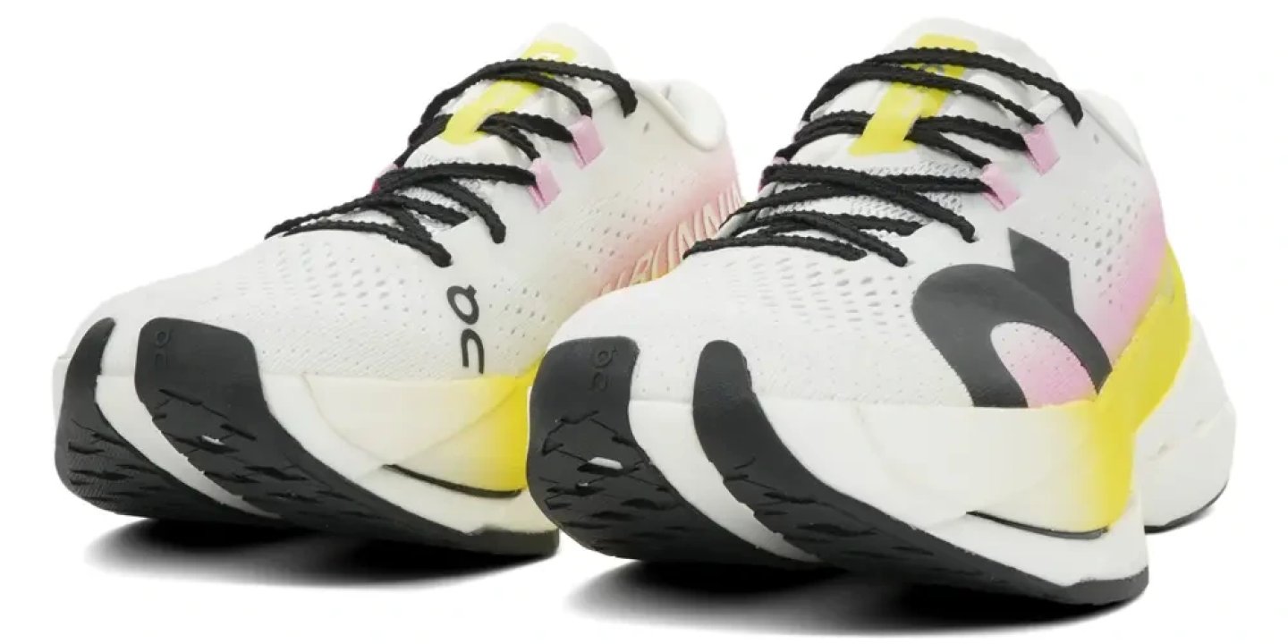 On Cloudboom Max 2 running shoes in white, pink and yellow, rear three-quarter view showing midsole and outsole detail