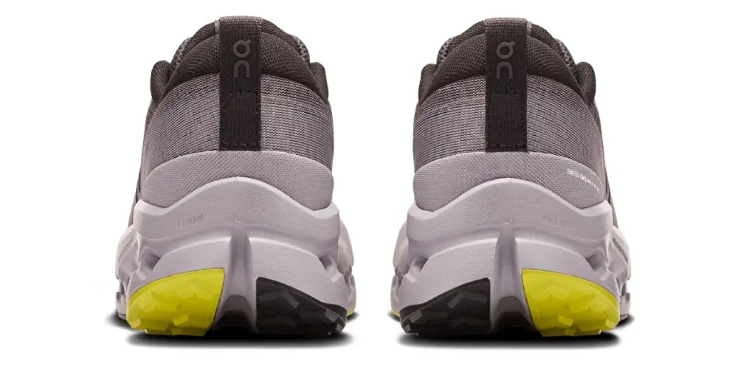 Rear view of On Cloudsurfer Trail 2 trail running shoes showing grey midsole, heel counter and yellow outsole