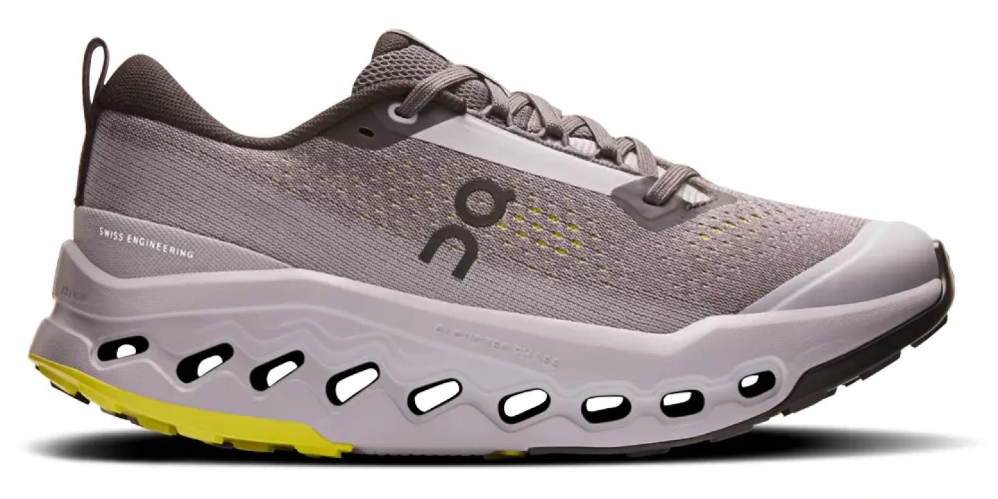 On Cloudsurfer Trail 2 running shoe in grey and yellow, lateral view showing CloudTec midsole pods and mesh upper