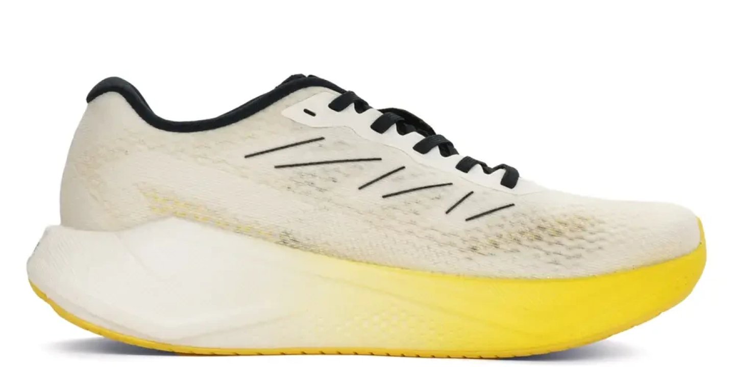 Salomon white knit running shoe with bold yellow outsole and black laces, lateral side view on white background