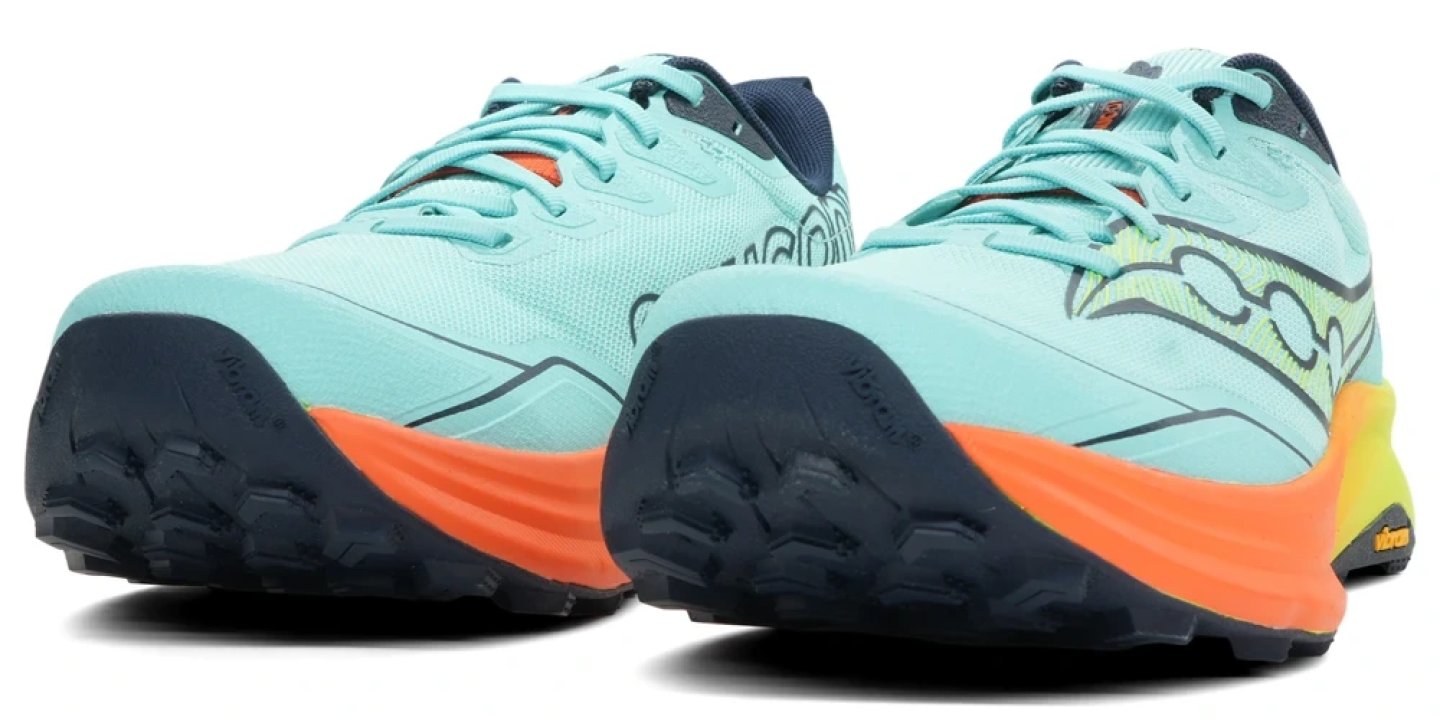 Saucony Peregrine trail running shoes in mint green and orange with dark navy Vibram outsole, rear three-quarter view