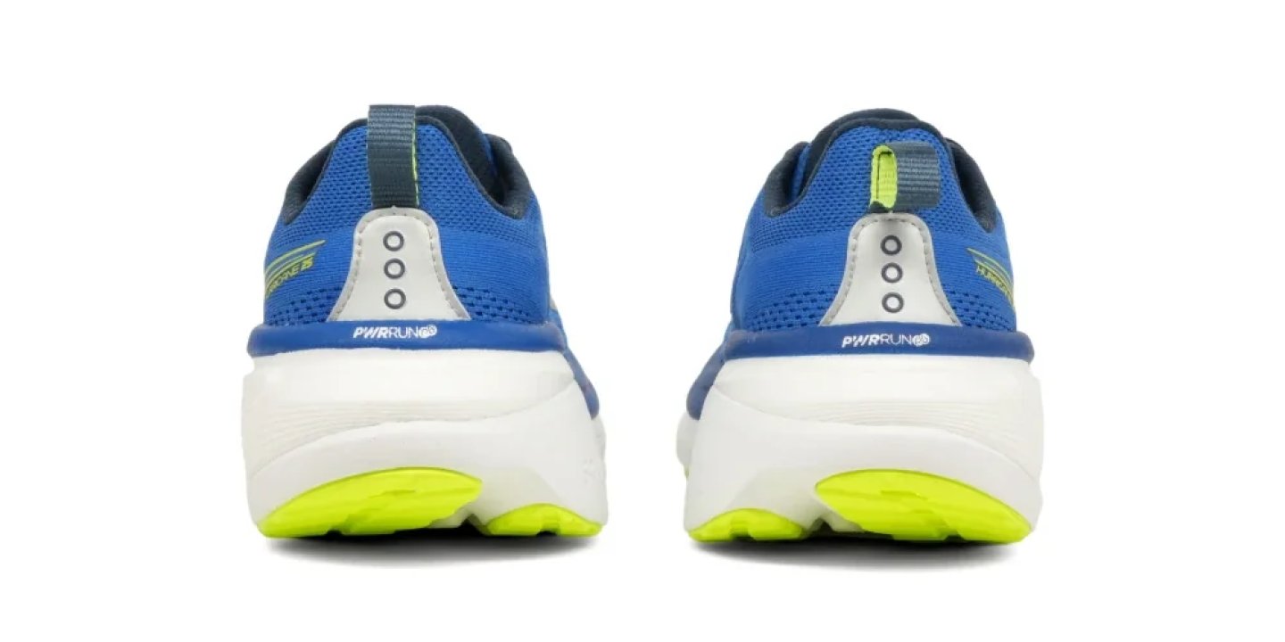 Rear view of Saucony running shoes in blue with a white PWRRUN midsole and neon yellow outsole.