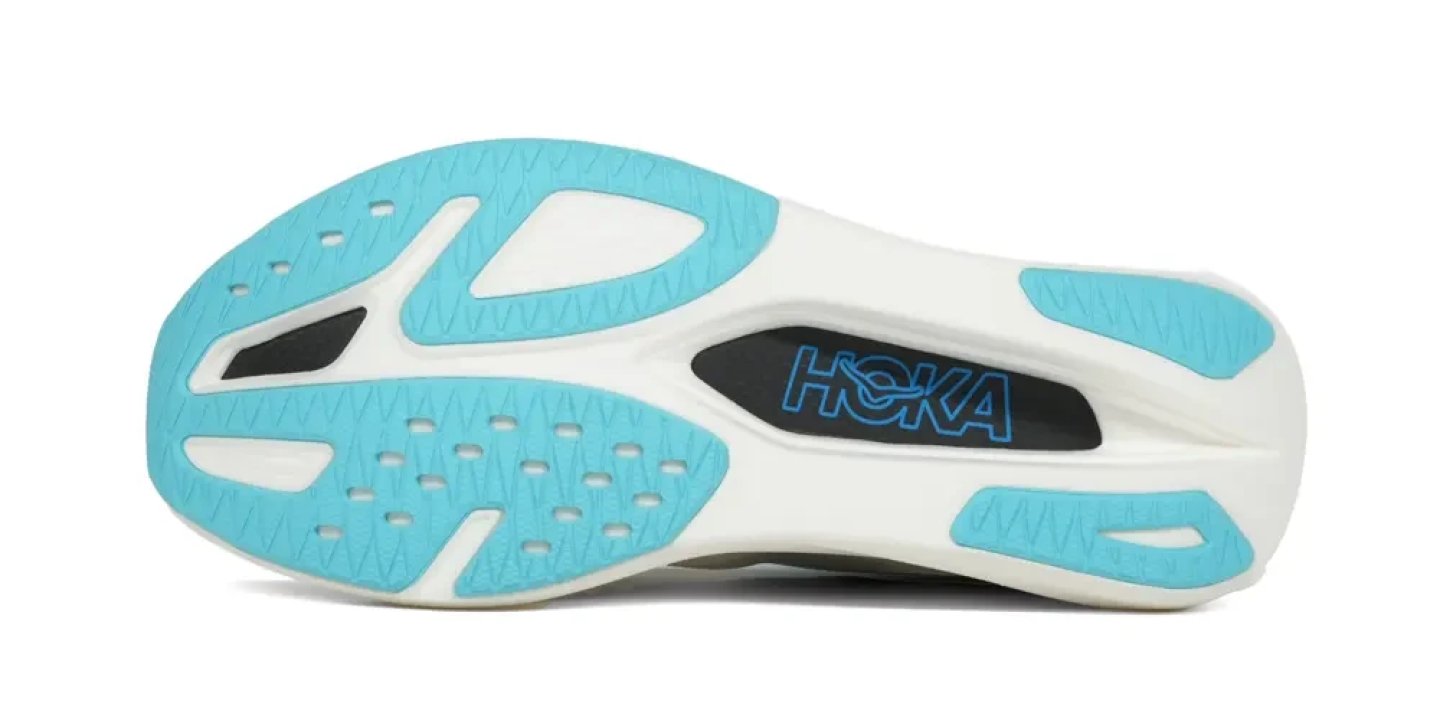 Bottom view of Hoka Rocket X 3 running shoe outsole showing aqua blue rubber traction zones and white midsole with HOKA branding