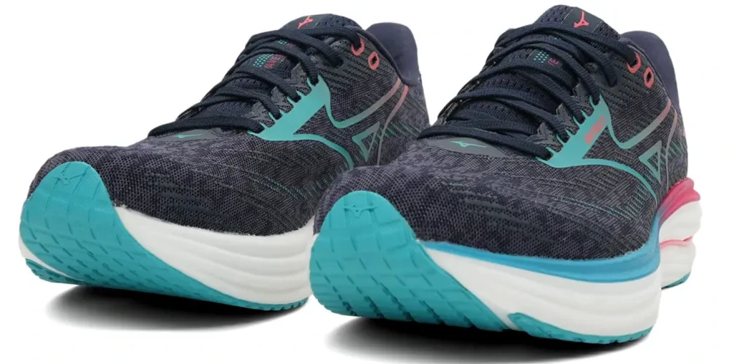Pair of Mizuno Wave Rider 29 women's running shoes in navy blue with teal outsole and pink heel accent