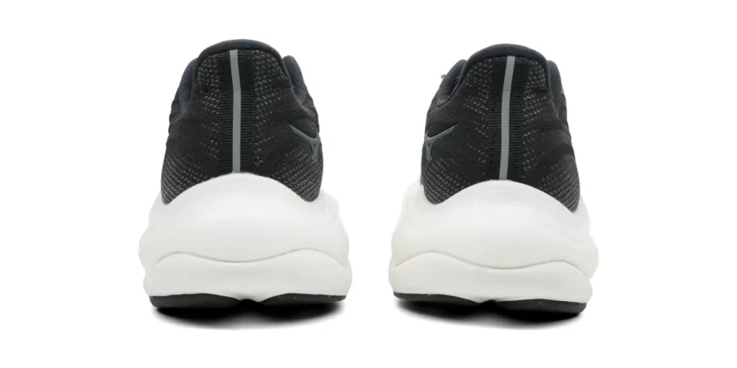 Rear view of Mizuno Wave Rider 9 running shoes in black knit upper with white midsole on white background