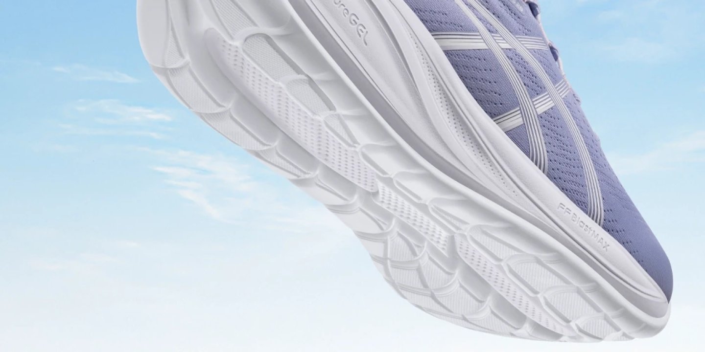 Asics Gel-Cumulus 28 running shoe in purple, showing white FF BLAST MAX cushioned outsole against a light blue sky