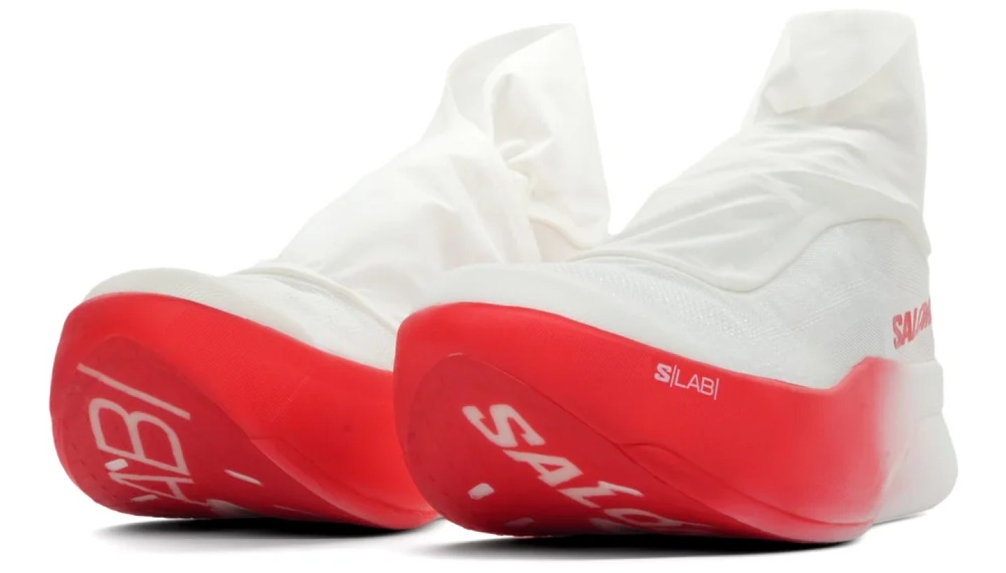 Salomon S/LAB running shoes with white sock upper and vivid red midsole, viewed from the heel.